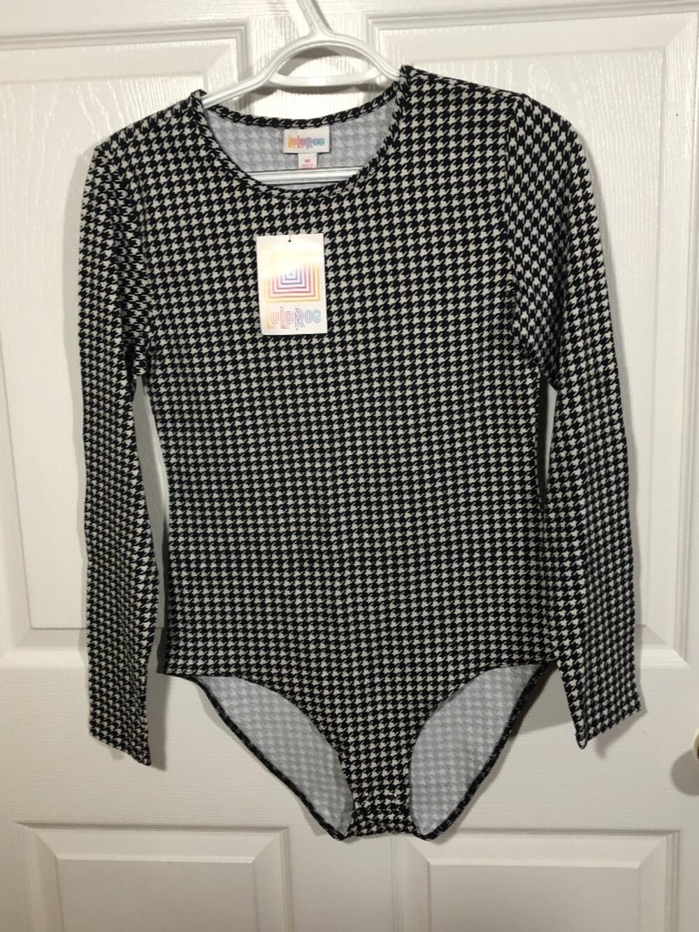 Lularoe women bodysuit with snap closure, white and black geometric print, M